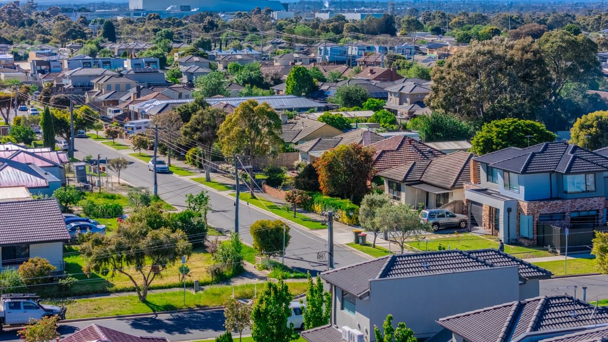 Suburban street with houses and trees