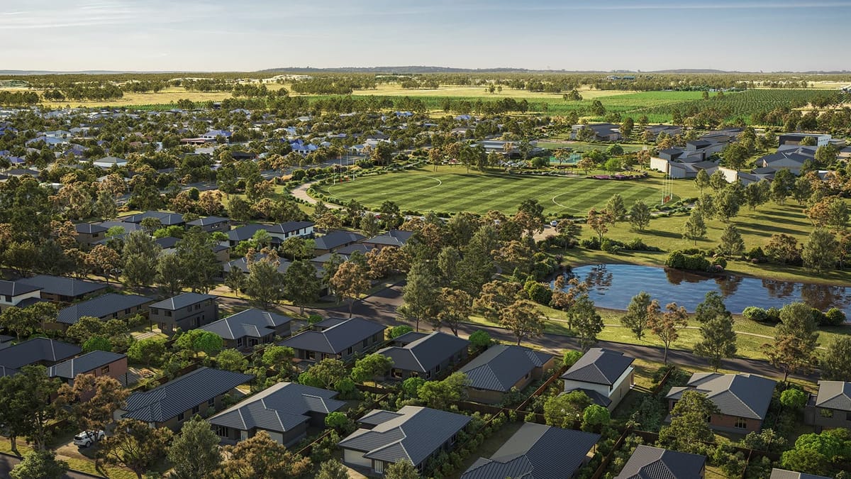 Residential community with soccer field and pond.