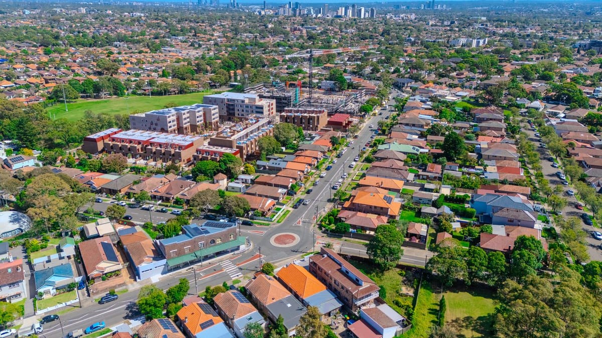 Aerial view of suburban neighborhood with residential homes and new construction.