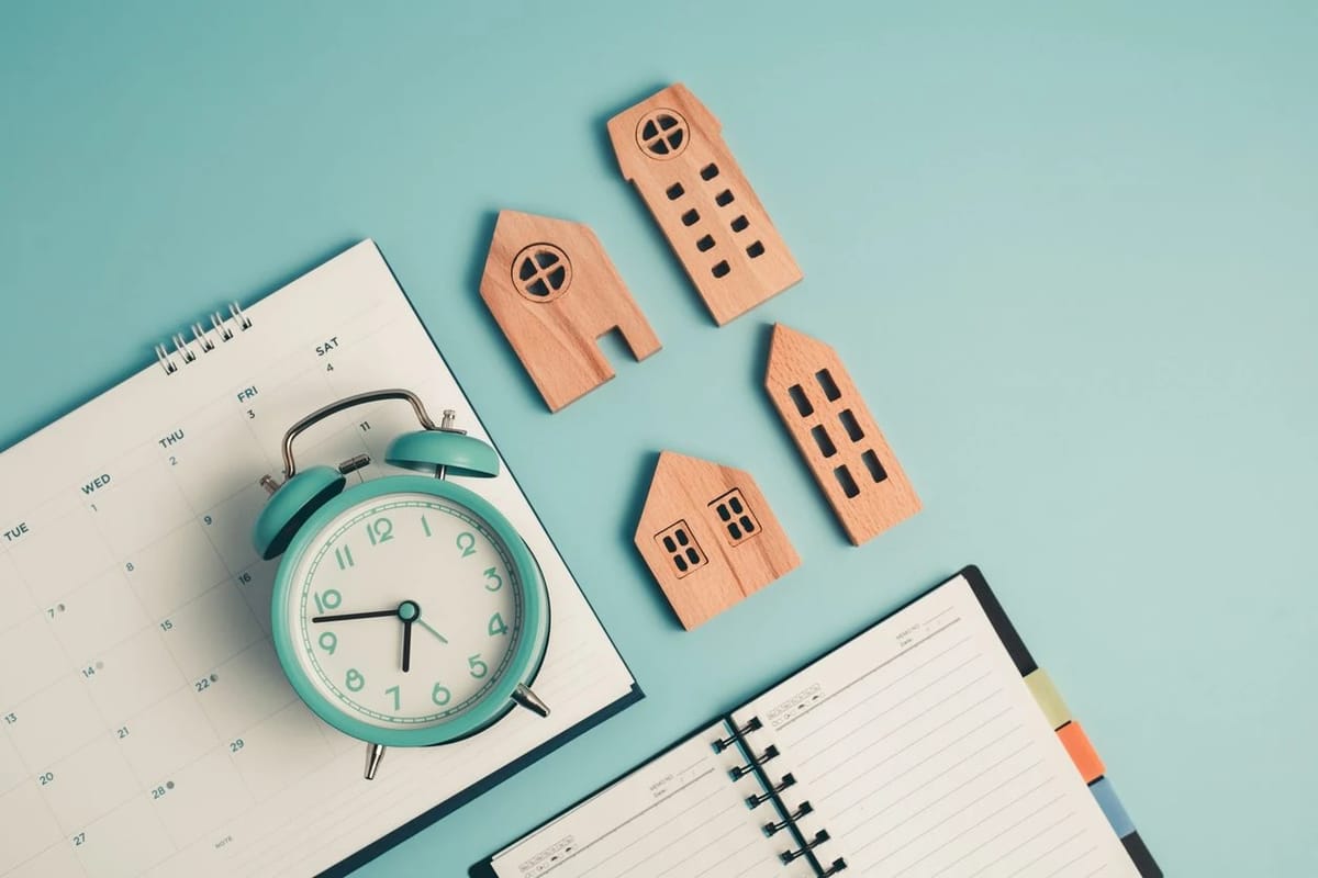 Property clock concept with calendar, clock and model houses for Australian market cycle analysis