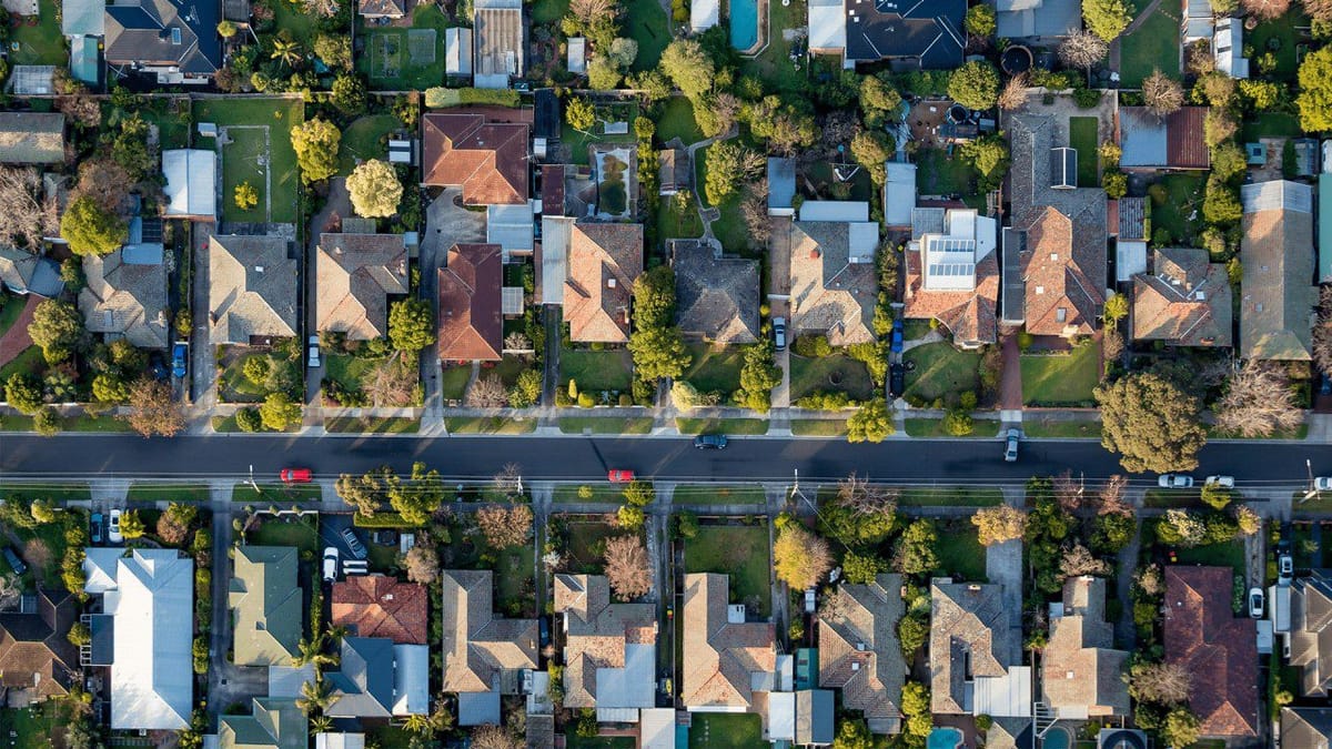 Aerial view of suburban houses along a street