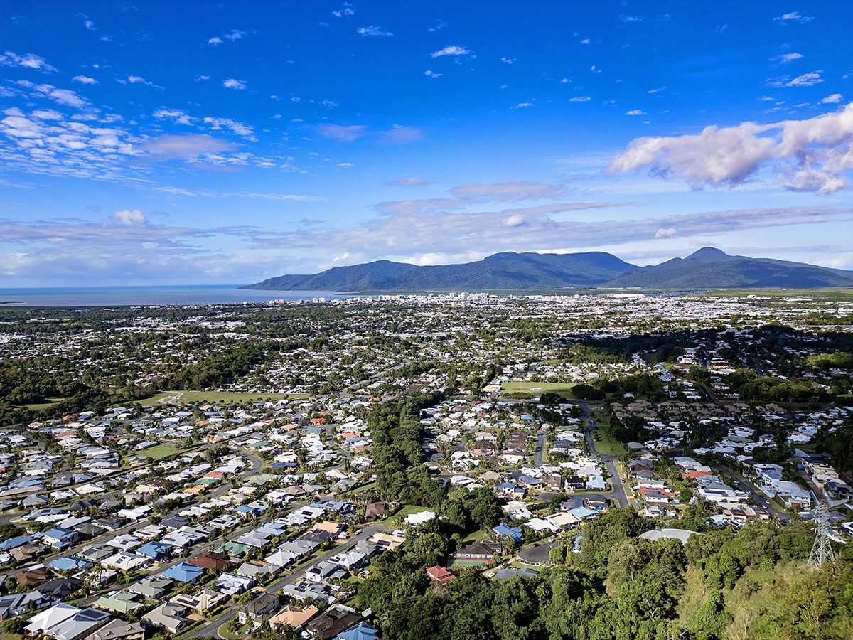 Aerial view of Cairns coastline and hills for the Cairns property market forecast