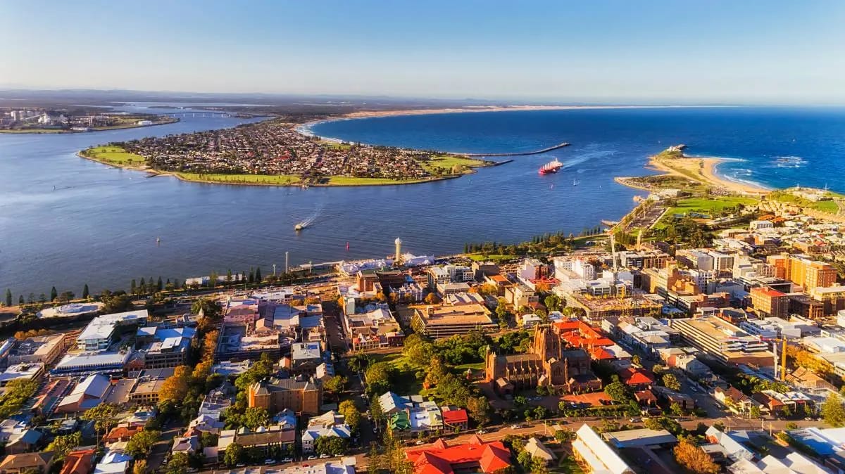 Aerial view of a coastal city with harbor and bay