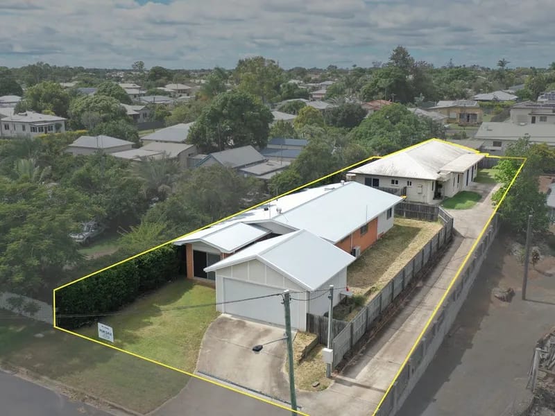 Two houses with yellow outline, aerial view.