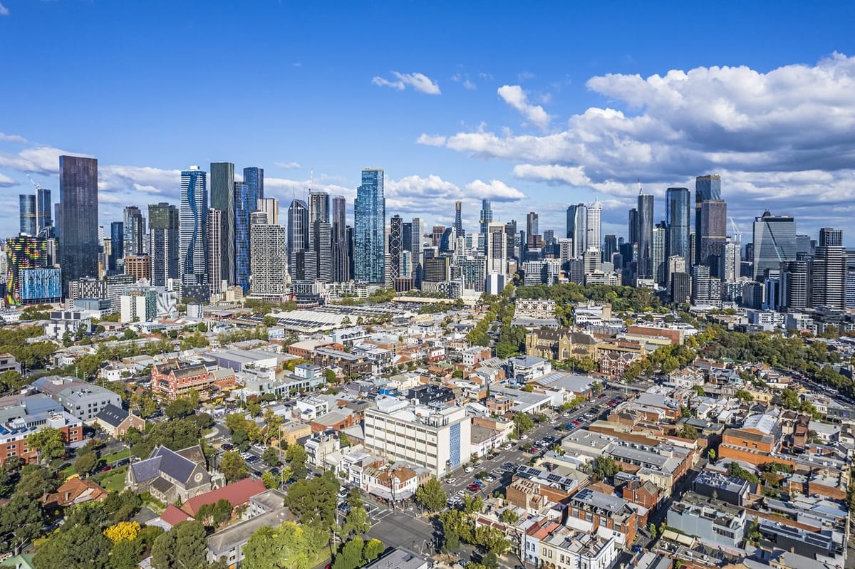 Skyline with high-rise buildings and a suburban foreground.