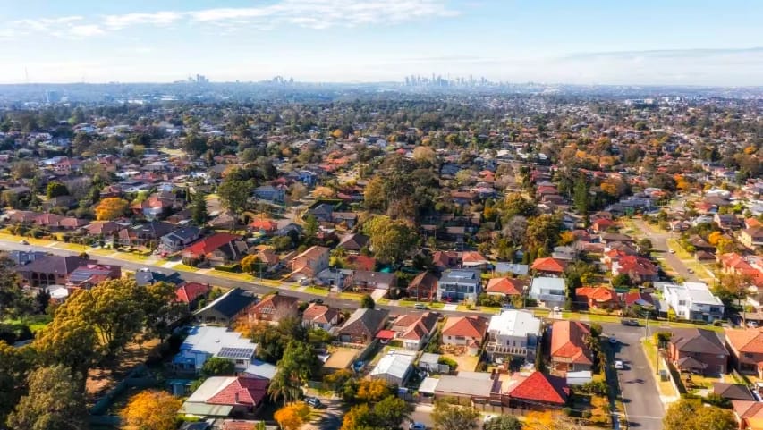 Residential neighborhood with a distant city skyline