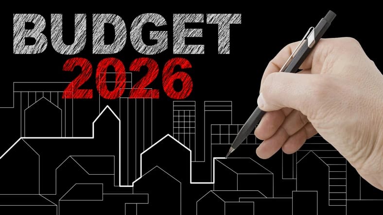 2026 Budget lettering above a hand drawing a housing skyline
