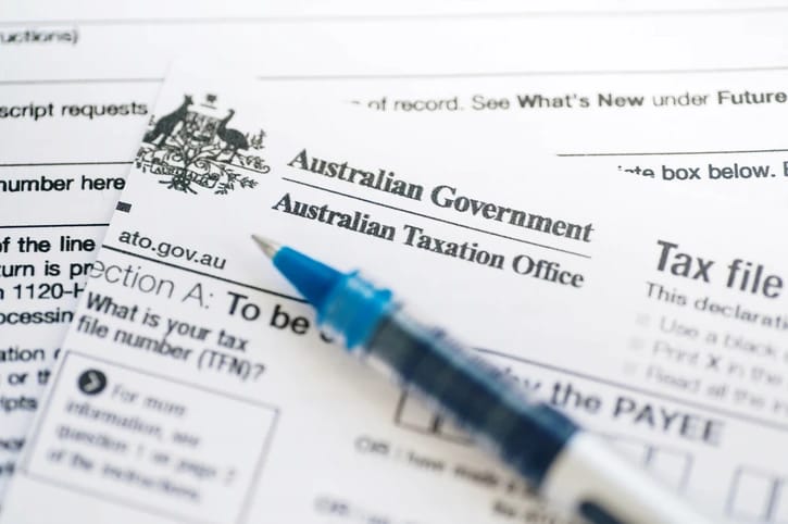 Australian Taxation Office form and pen on a desk