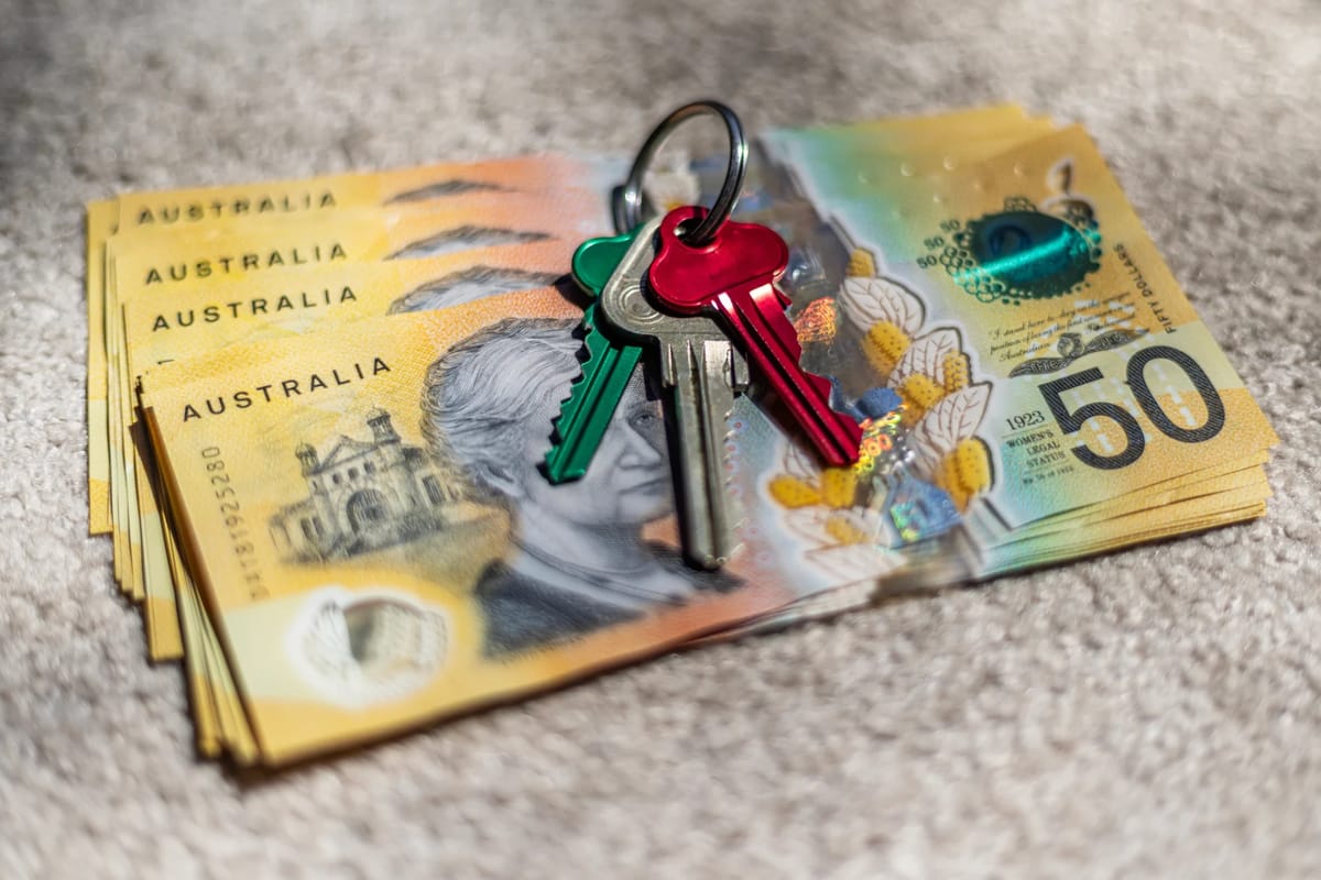 Australian banknotes and house keys resting on carpet