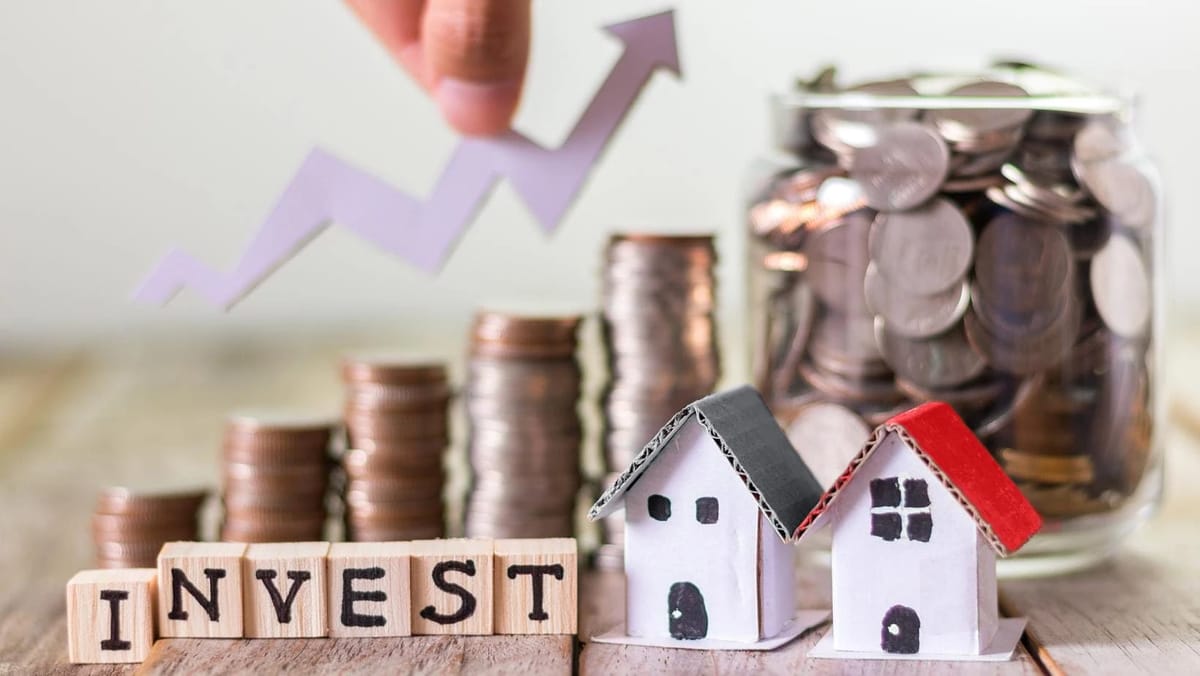 Model houses, coin stacks and an upward investment arrow