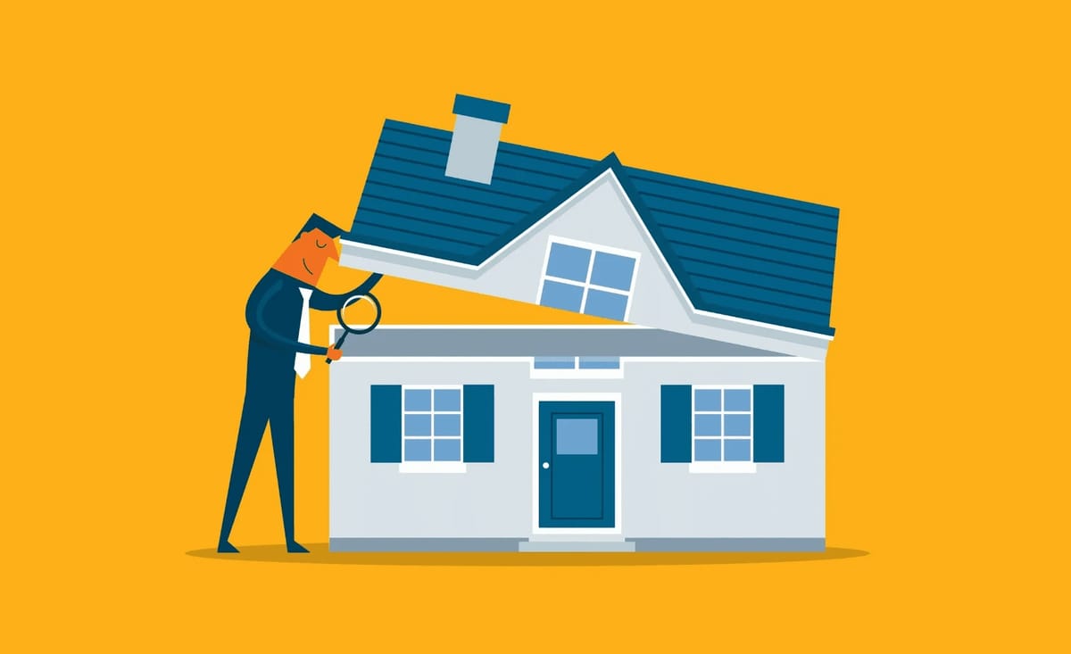 Man with magnifying glass inspecting a house