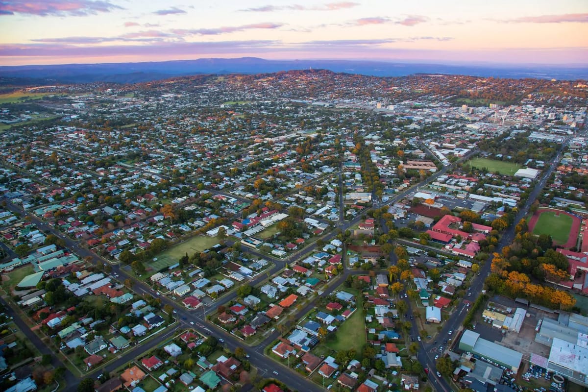 Aerial view of suburban town at sunset