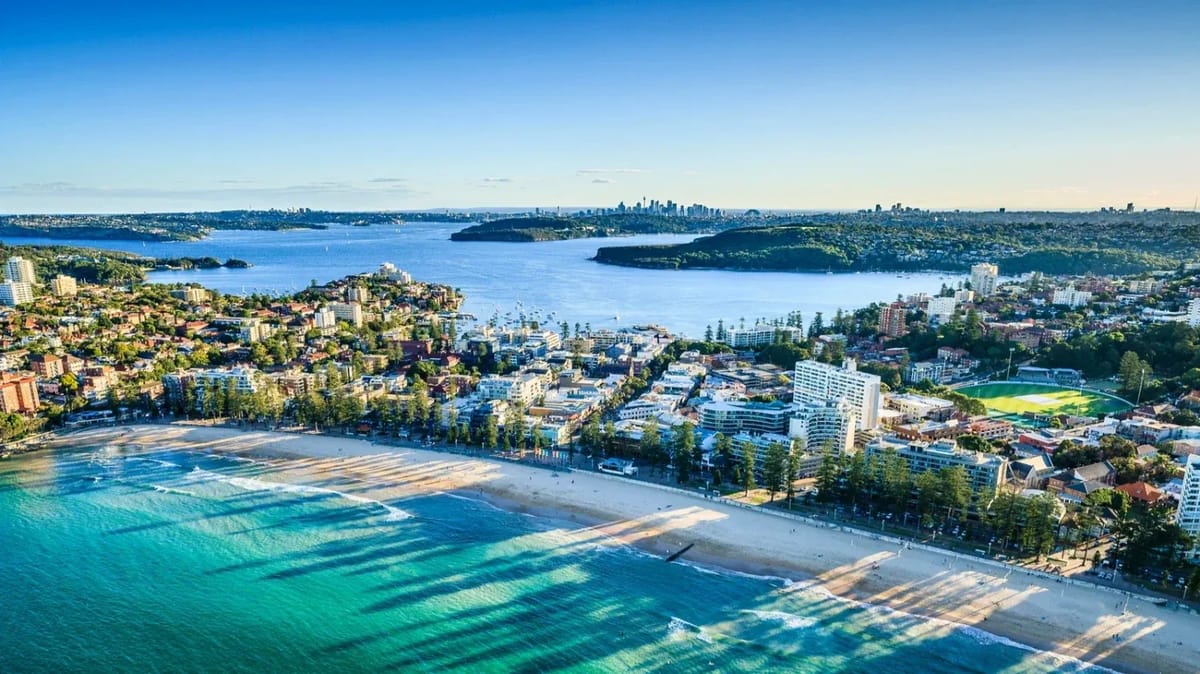 Coastal city skyline with beach and blue water