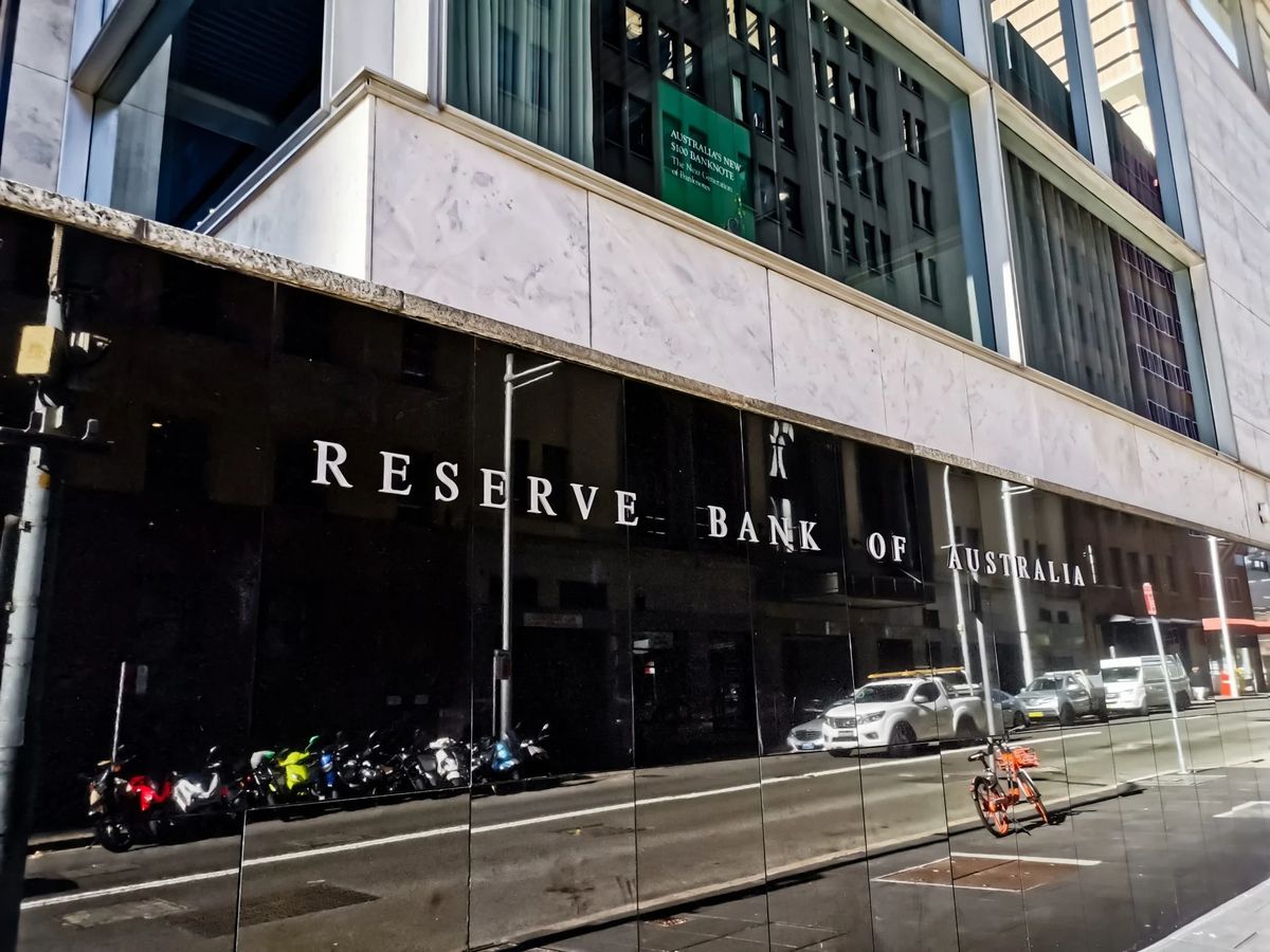 Reserve Bank of Australia building reflection with motorcycles