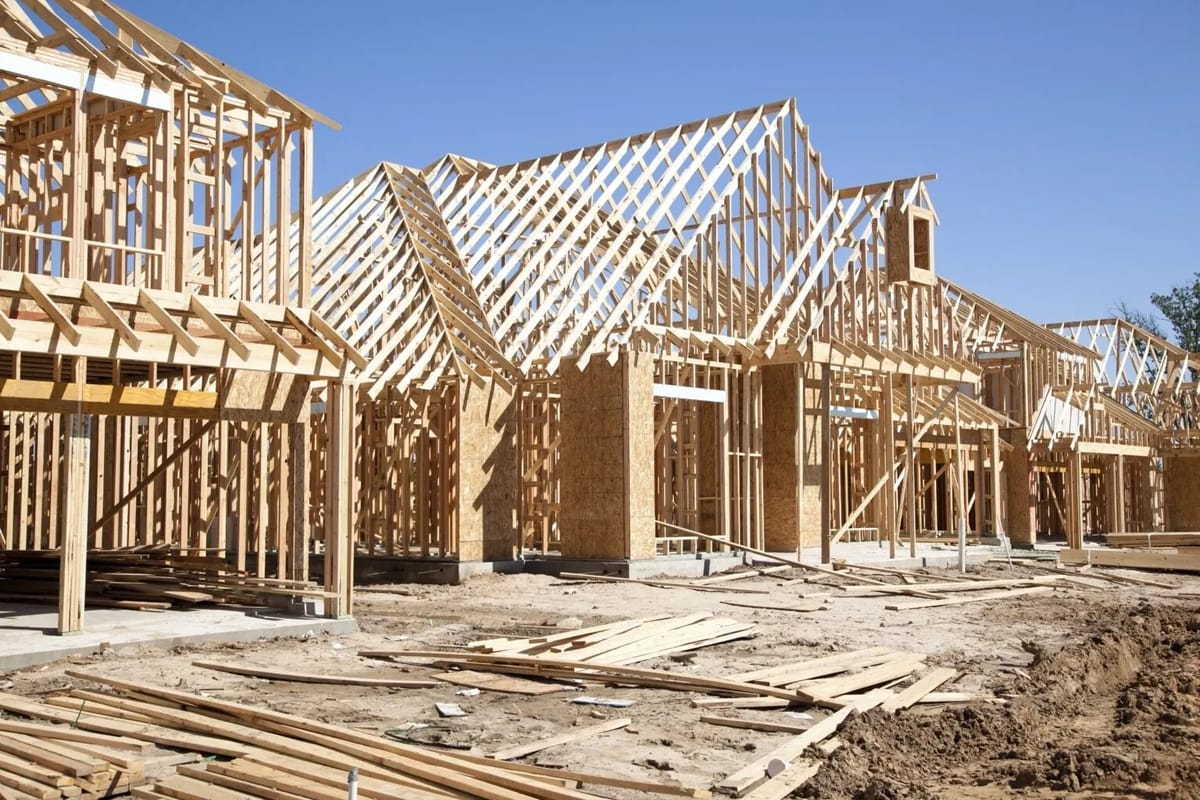 New homes under construction, wood framing visible