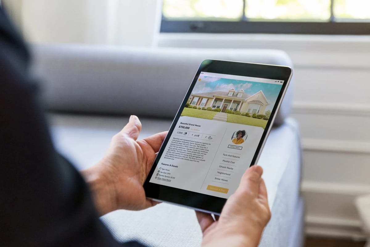 Real estate app on a tablet showing a house listing.