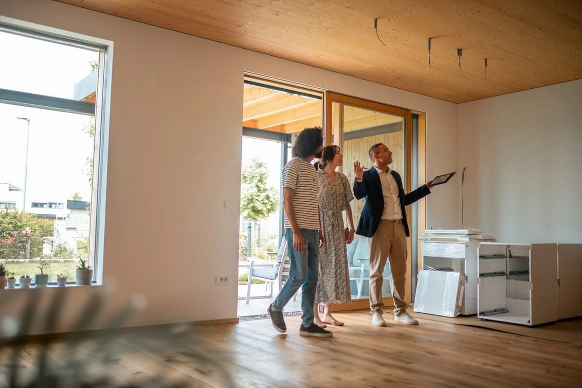Real estate agent shows house to a couple.