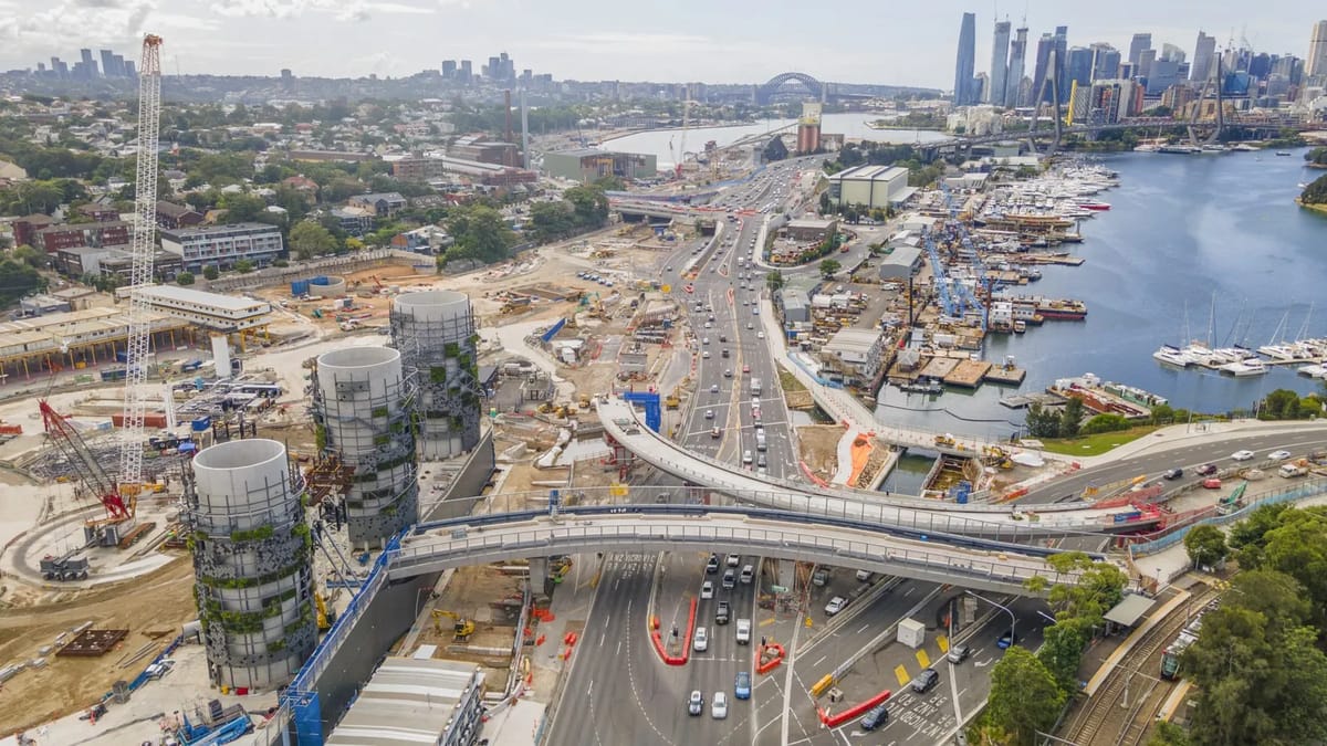 Construction of concrete towers and a highway interchange.