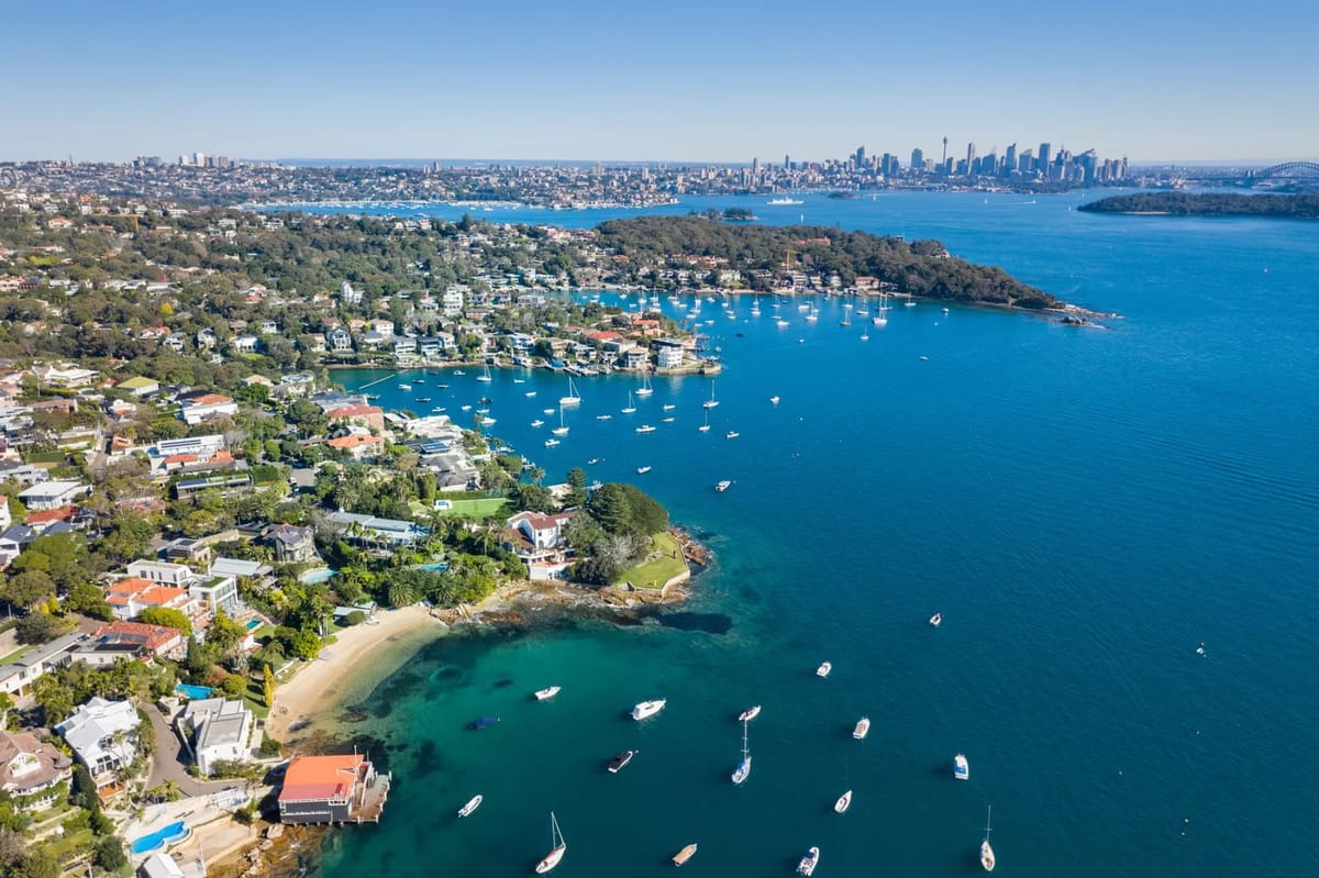 Sydney harbor with boats and cityscape in background
