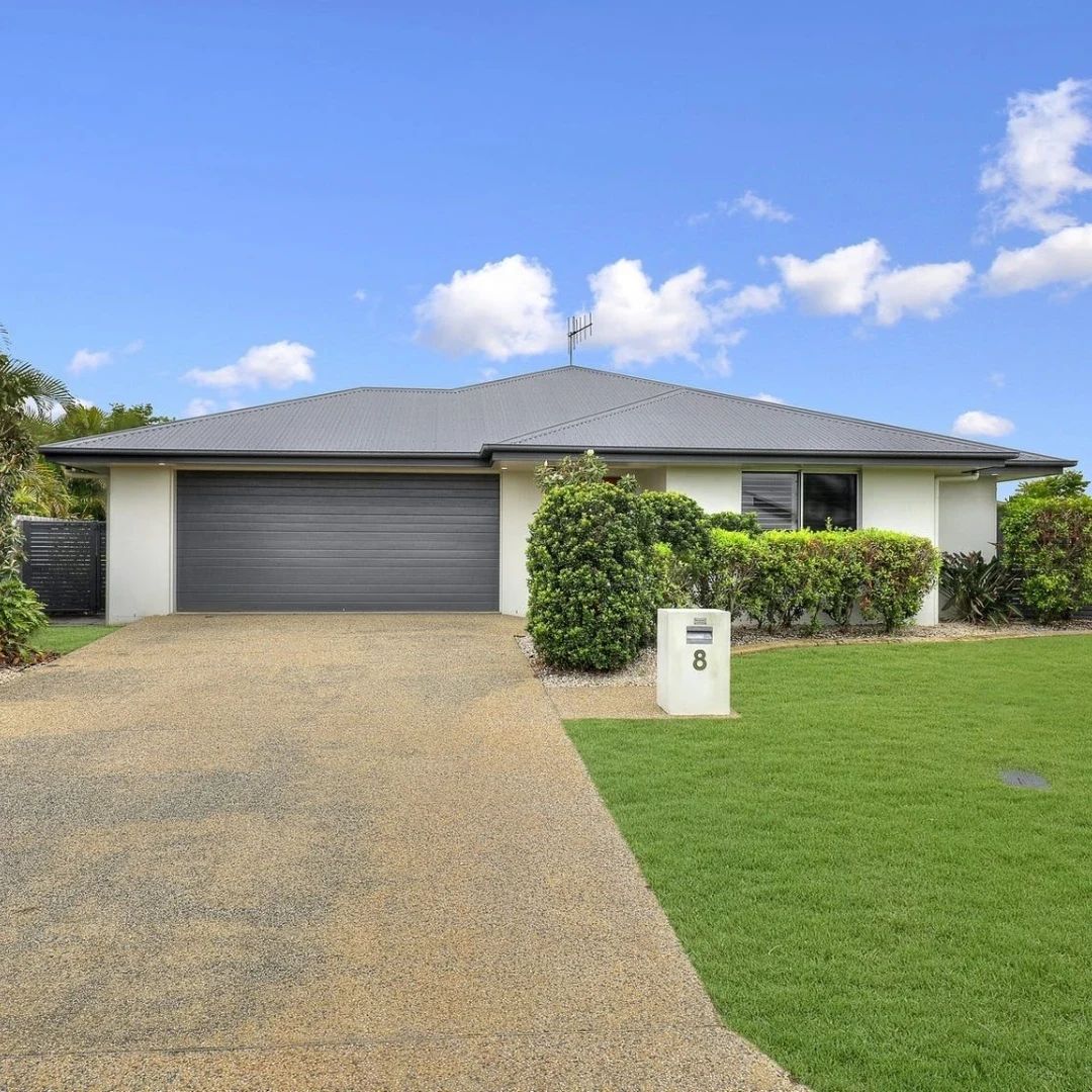 Home with garage, mailbox, and green lawn