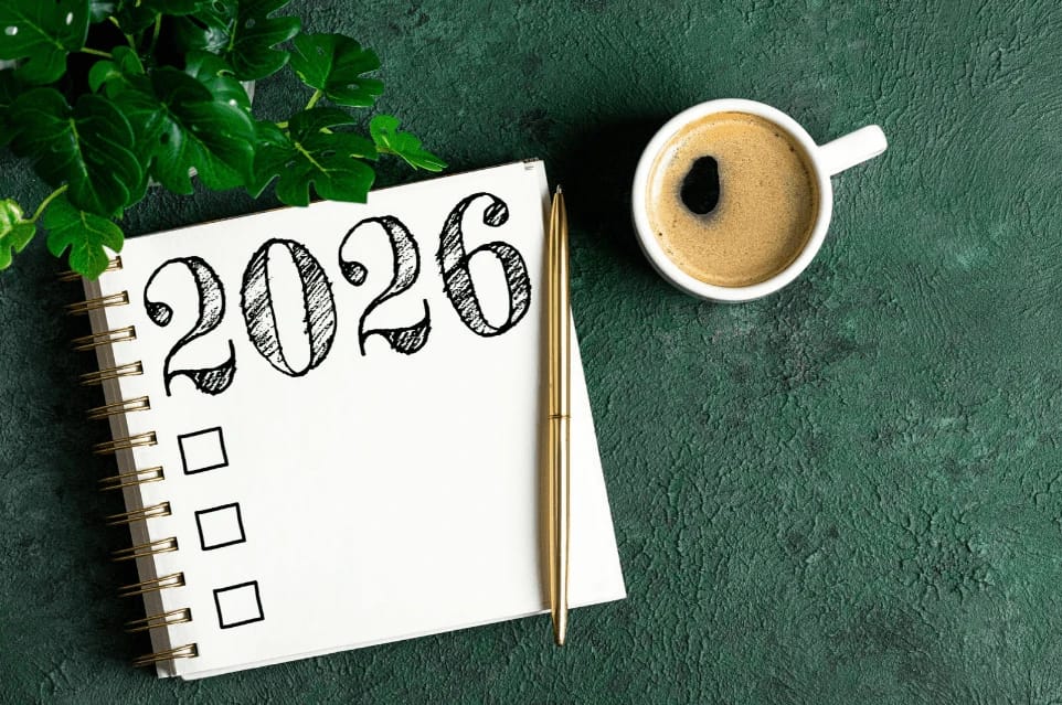 Notebook with 2026 and checklist, with coffee.