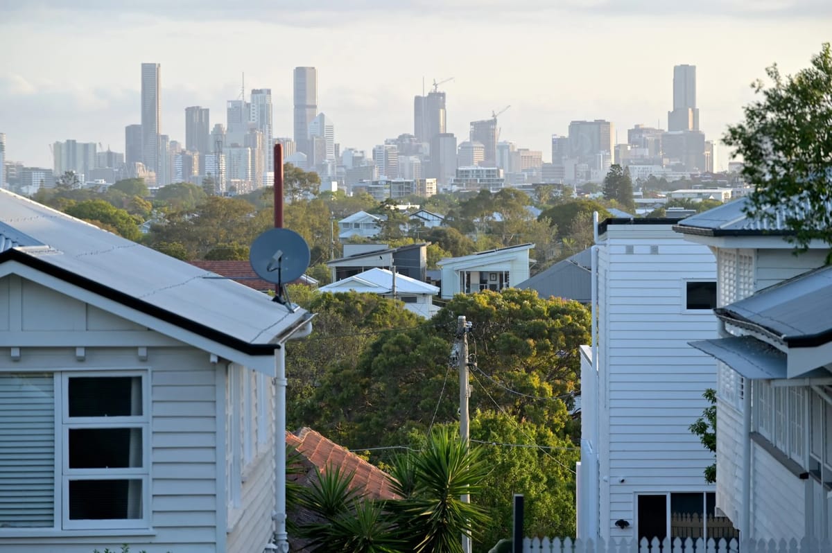 City skyline over houses and trees