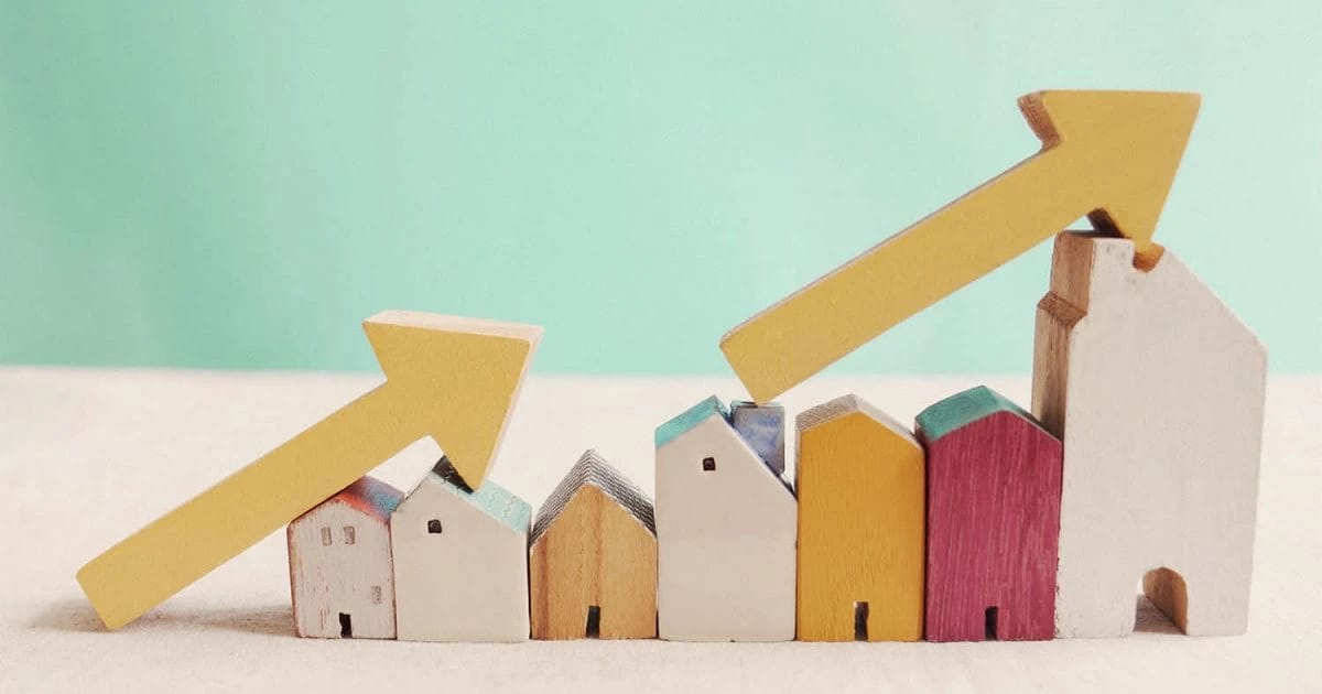 Wooden houses and rising arrow chart