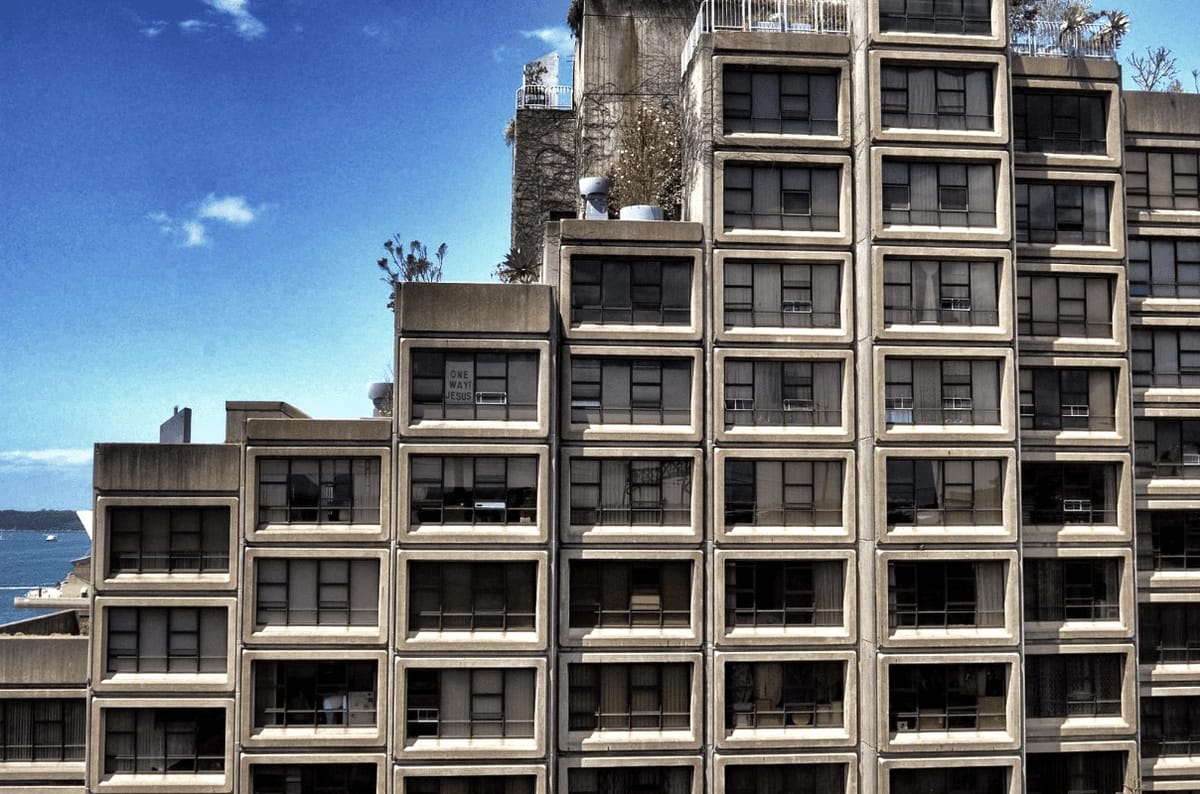 Concrete brutalist building with many windows