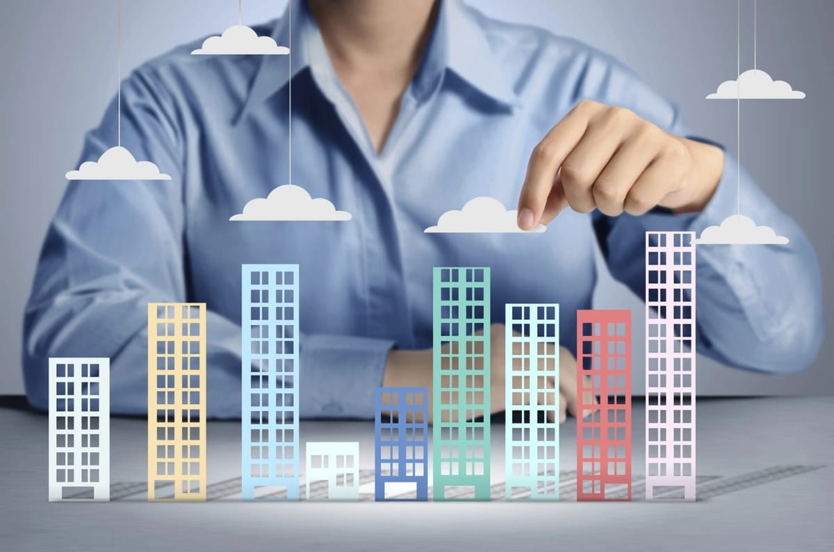 Infographic of buildings as bar chart with clouds.