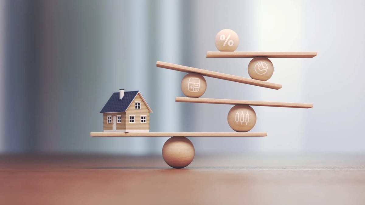 House and financial symbols on a balancing scale.