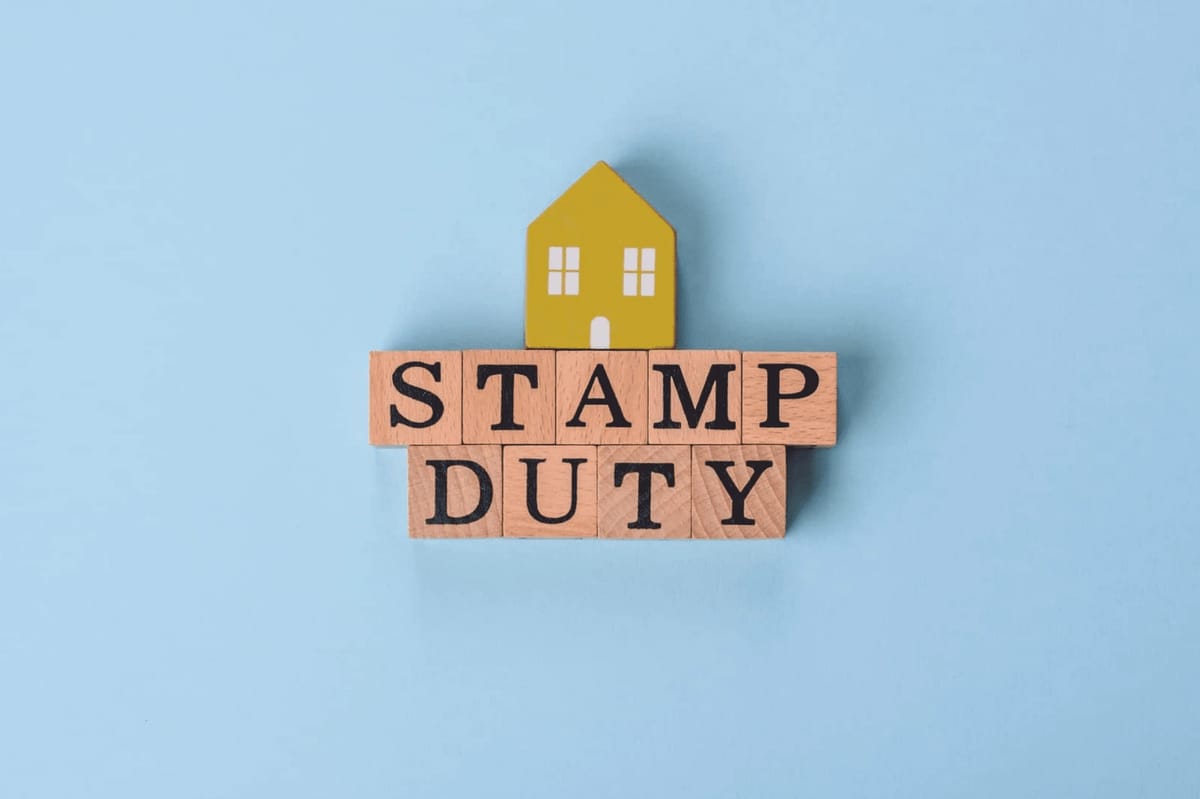 Stamp duty on wooden blocks with a house.