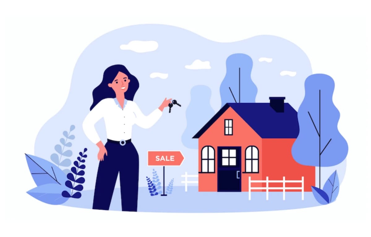 Realtor holding keys in front of a house with a sale sign.