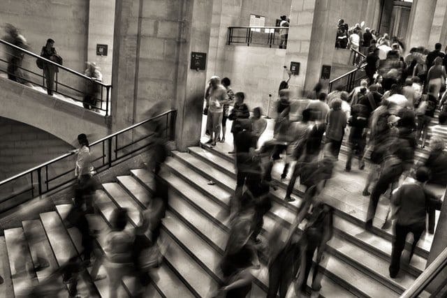 Blurred crowd on a grand staircase.