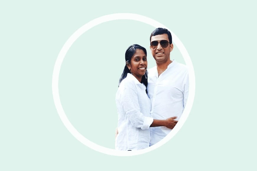 Couple in white shirts smiling inside a circle on a light green background.