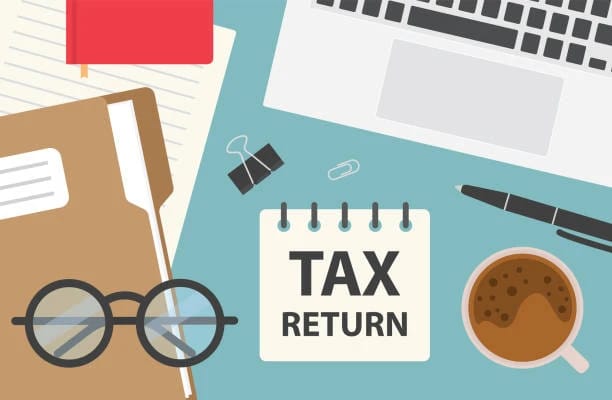 Tax return illustration with a calculator, glasses and paperwork