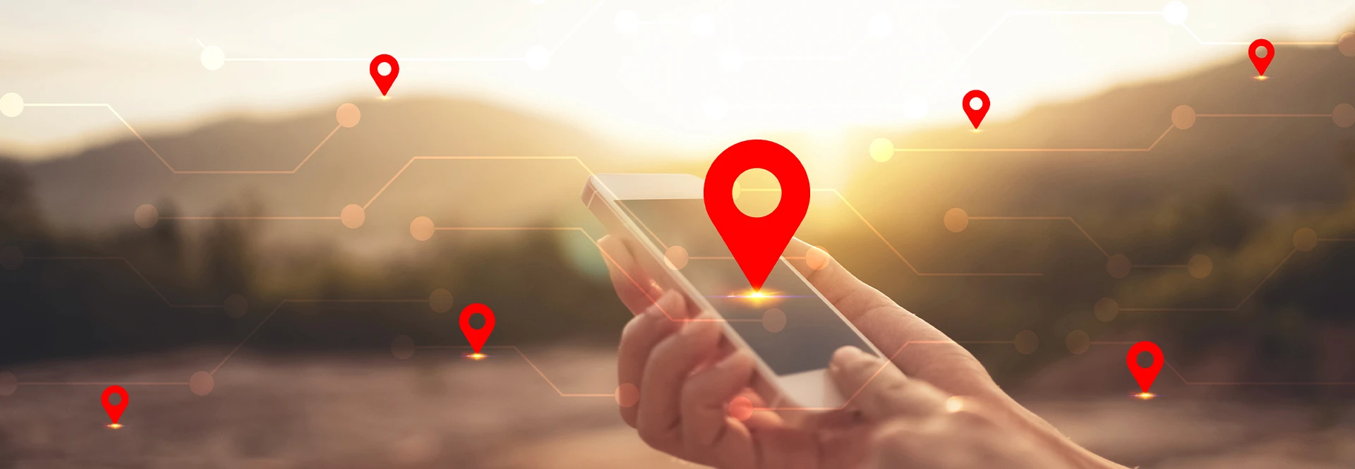 Hand holding a phone with map pins over potential interstate property locations