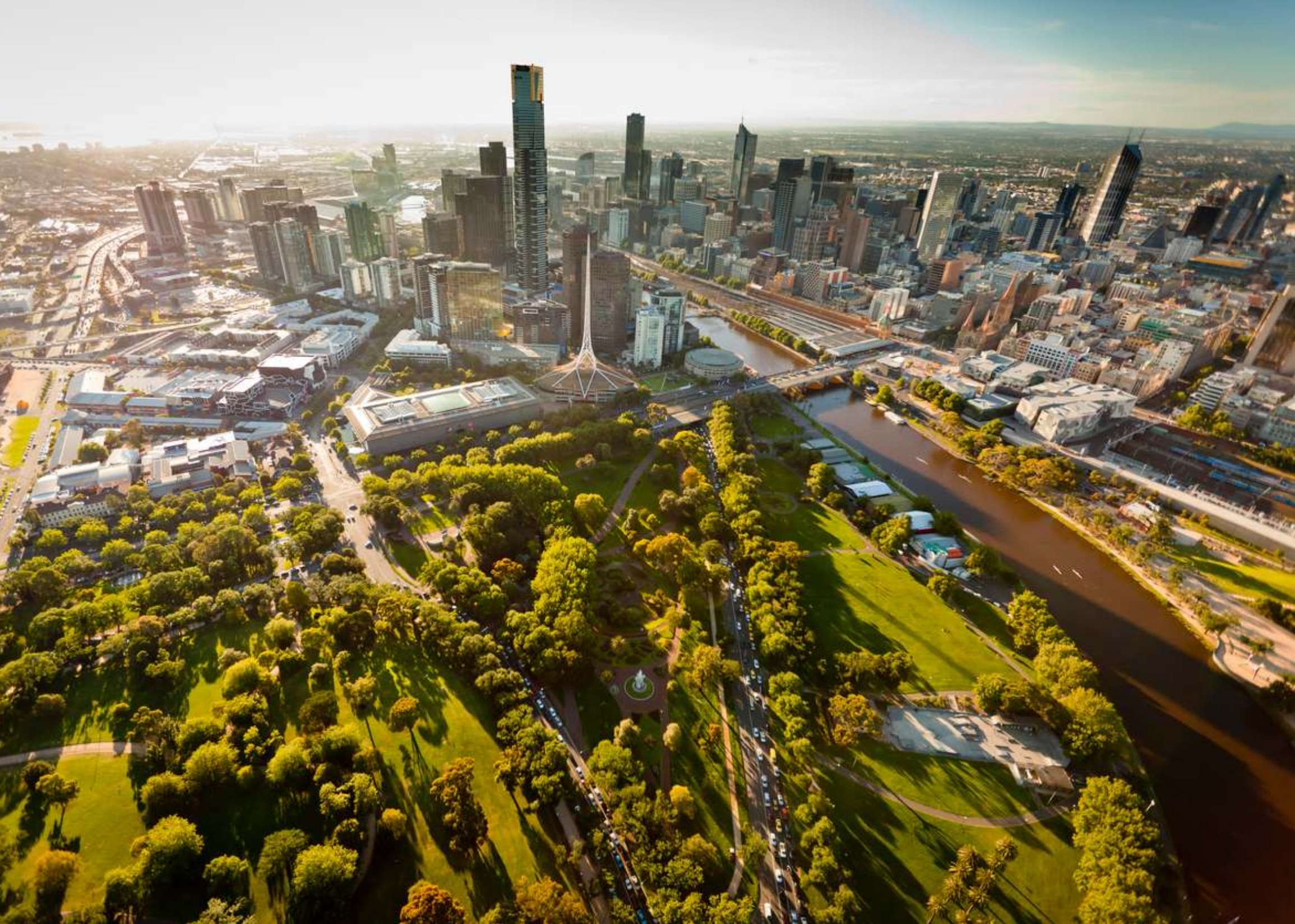 a city with a river and trees